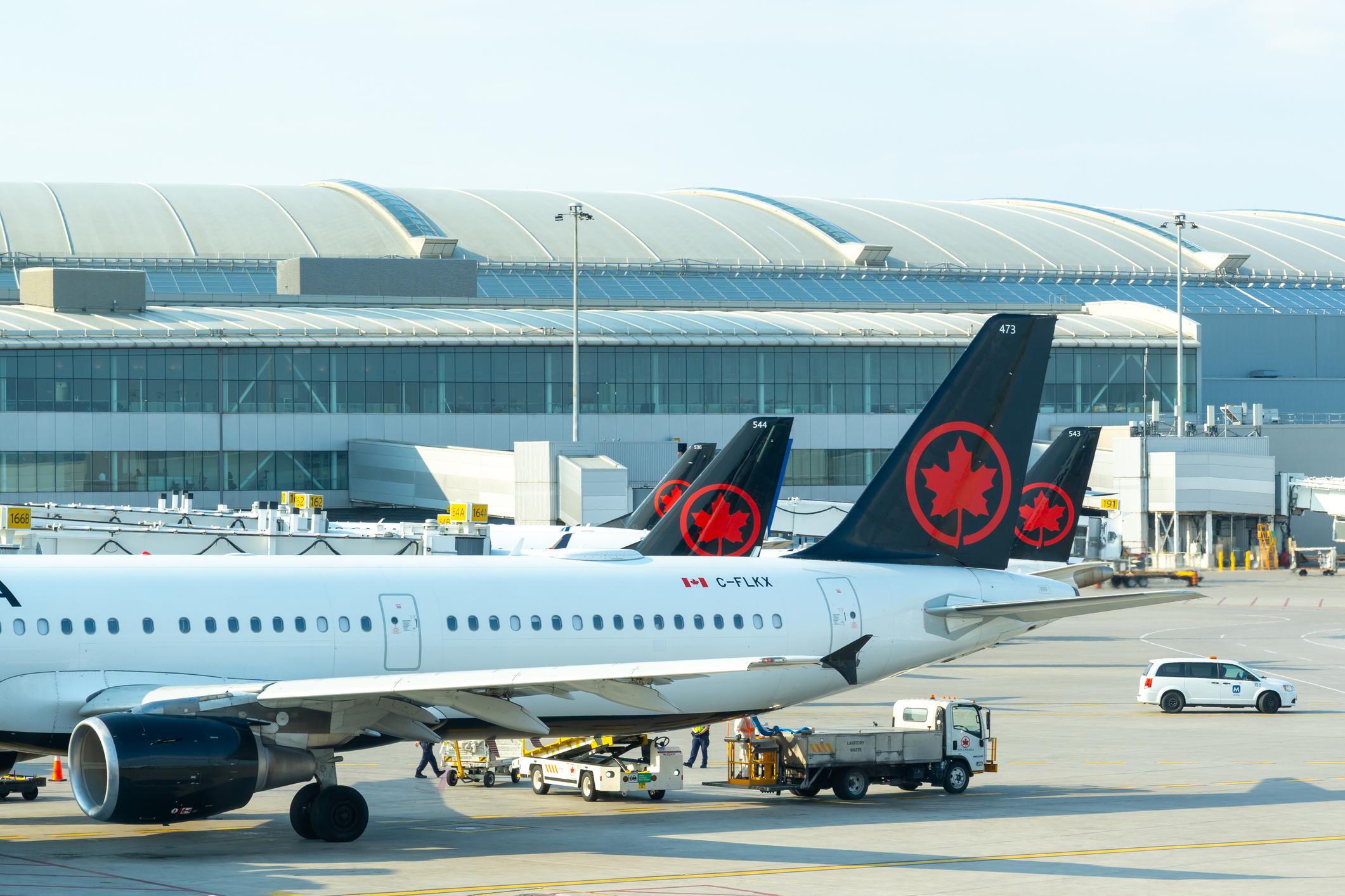 Mississauga, ON, Canada - May 7, 2025: Air Canada planes parked at Toronto’s Pearson International Airport in Mississauga, ON, Canada.