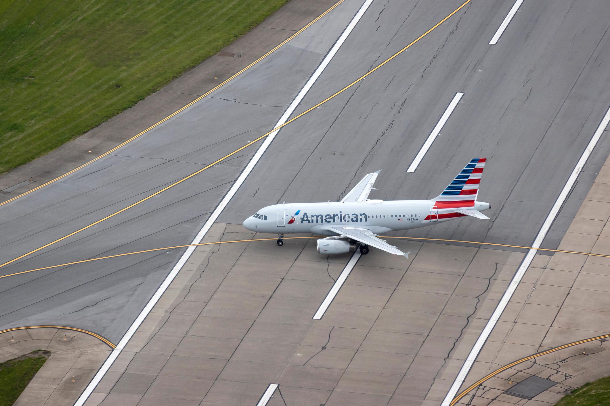 American Airlines Airbus 319-132 crosses runway 10 center taxing to the gate at Pittsburgh international Airport Pittsburgh Pa