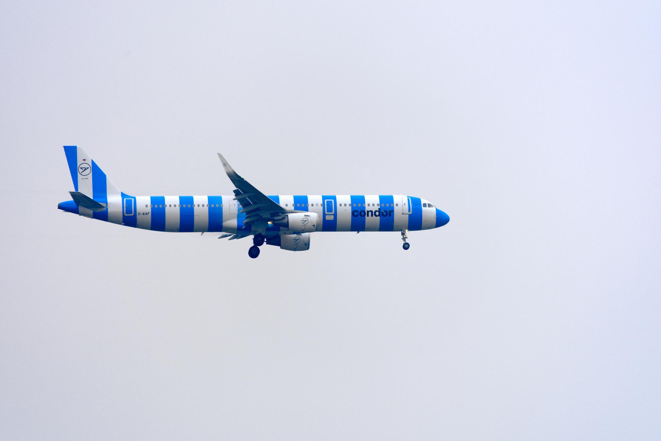 Side view of Condor passenger airplane type Airbus A321-211 registration D-AIAF on final approach to Swiss Zürich Airport on a foggy autumn day. Photo taken December 14th, 2025, Zurich Niederglatt Nöschikon, Switzerland.