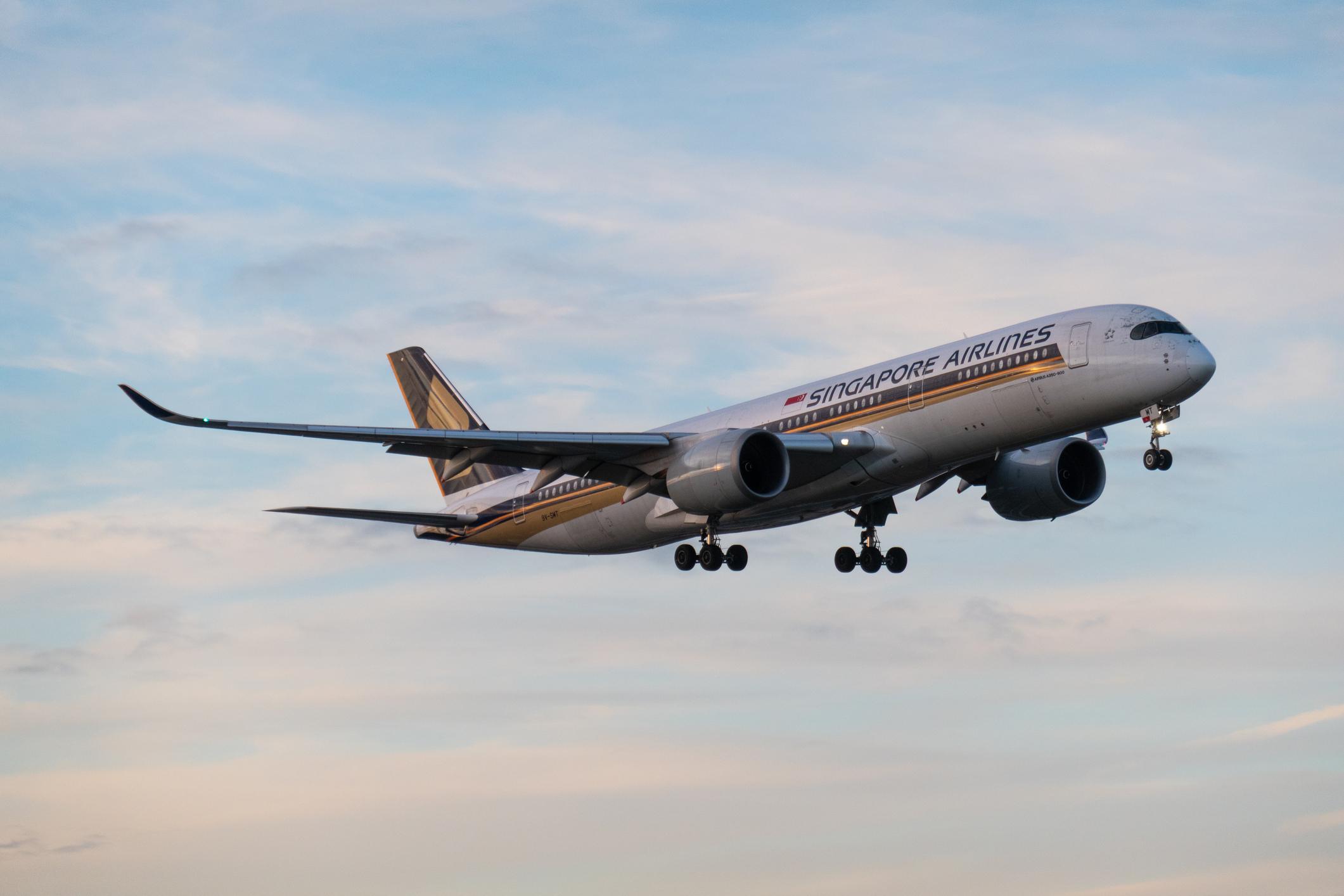 A Singapore Airlines Airbus A350-941 plane, registration 9V-SMT, landing at Sydney Kingsford Smith Airport as flight SQ241 from Singapore. This image was taken from New Link Road, Mascot on a cold, windy and sunny afternoon shortly before sunset on 14 June 2025.