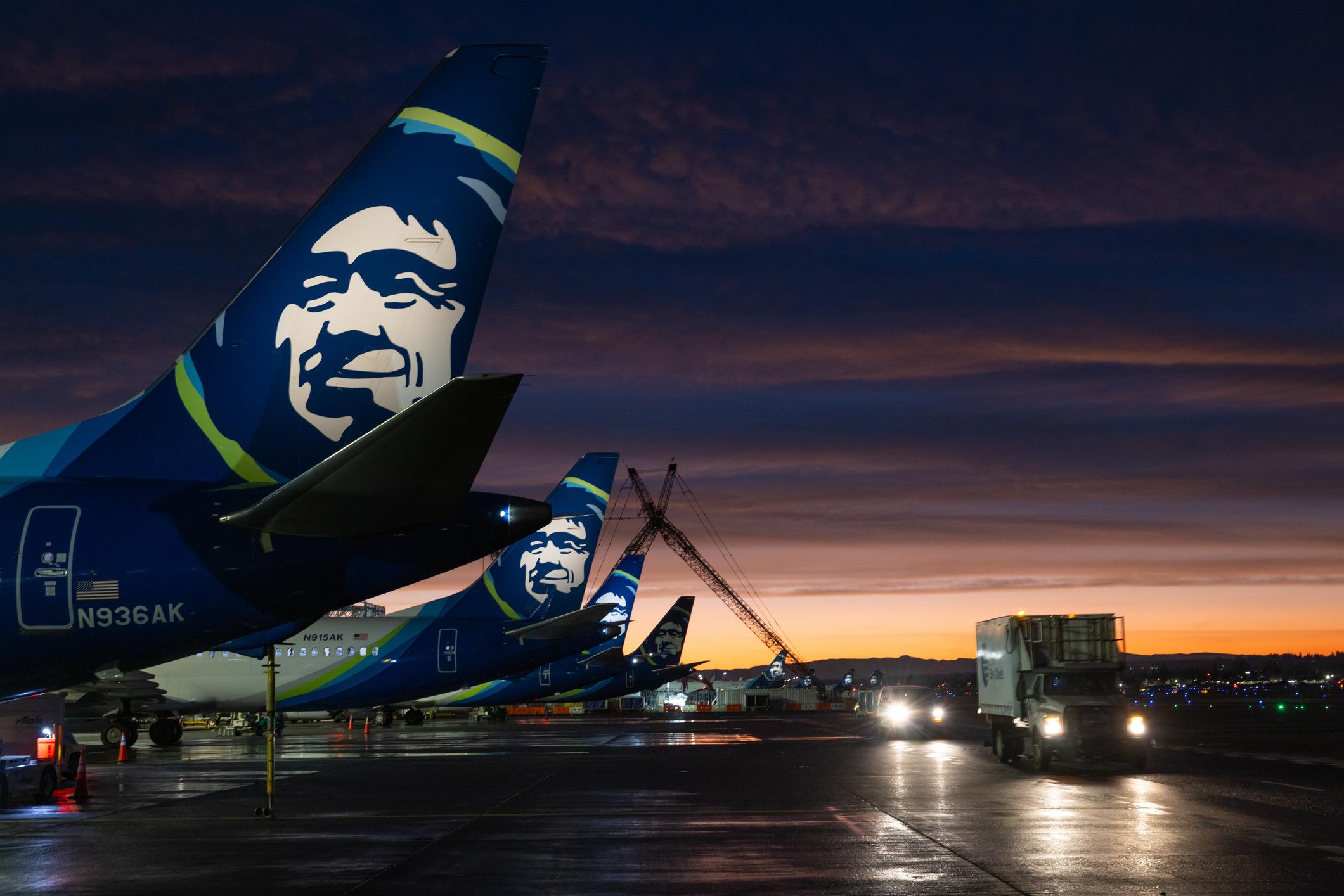 A row of Alaska Airlines Airplanes lined up at Portland International Airport PDX