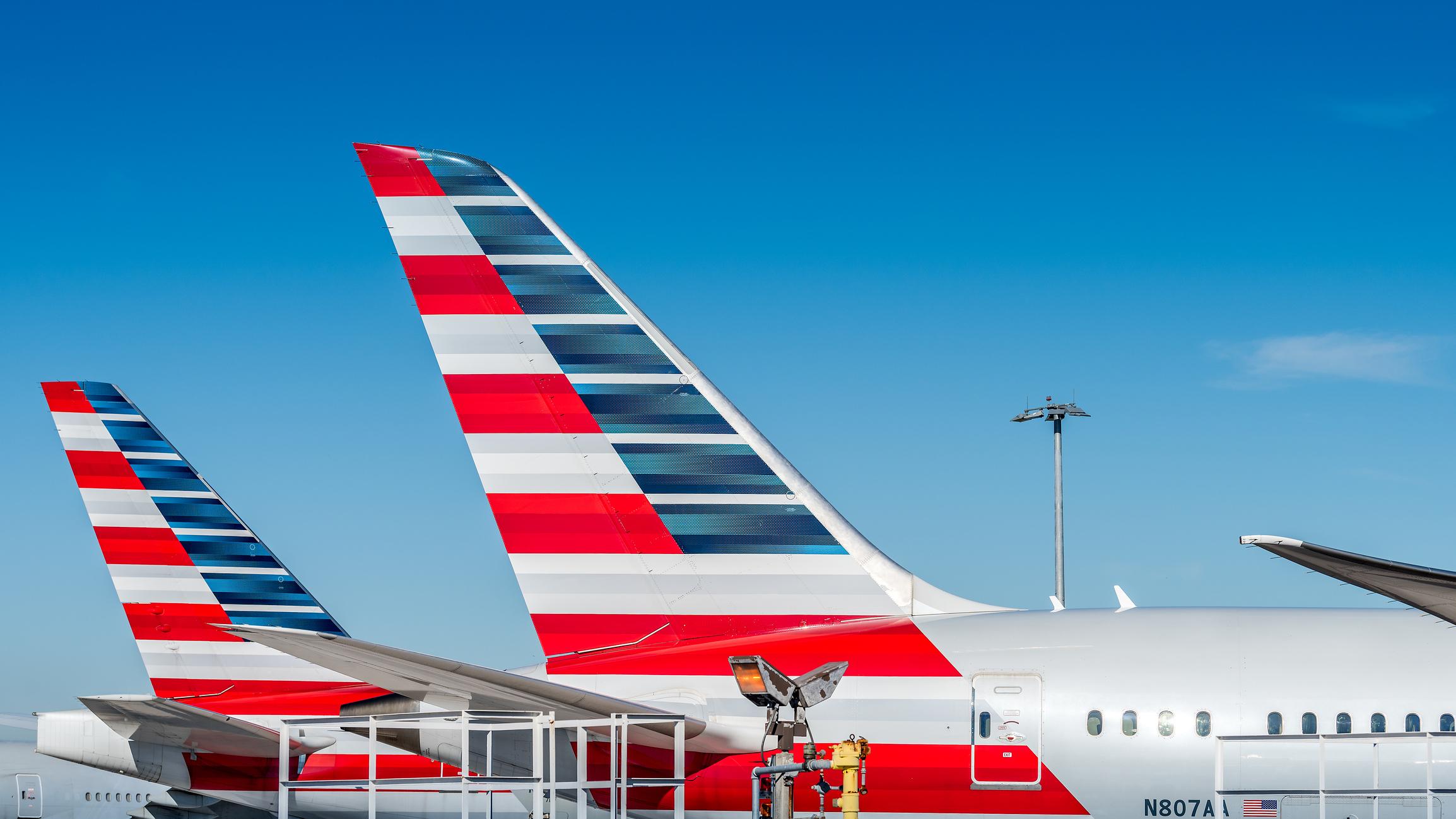 America Airlines planes waiting for passengers at Miami International Airport.
