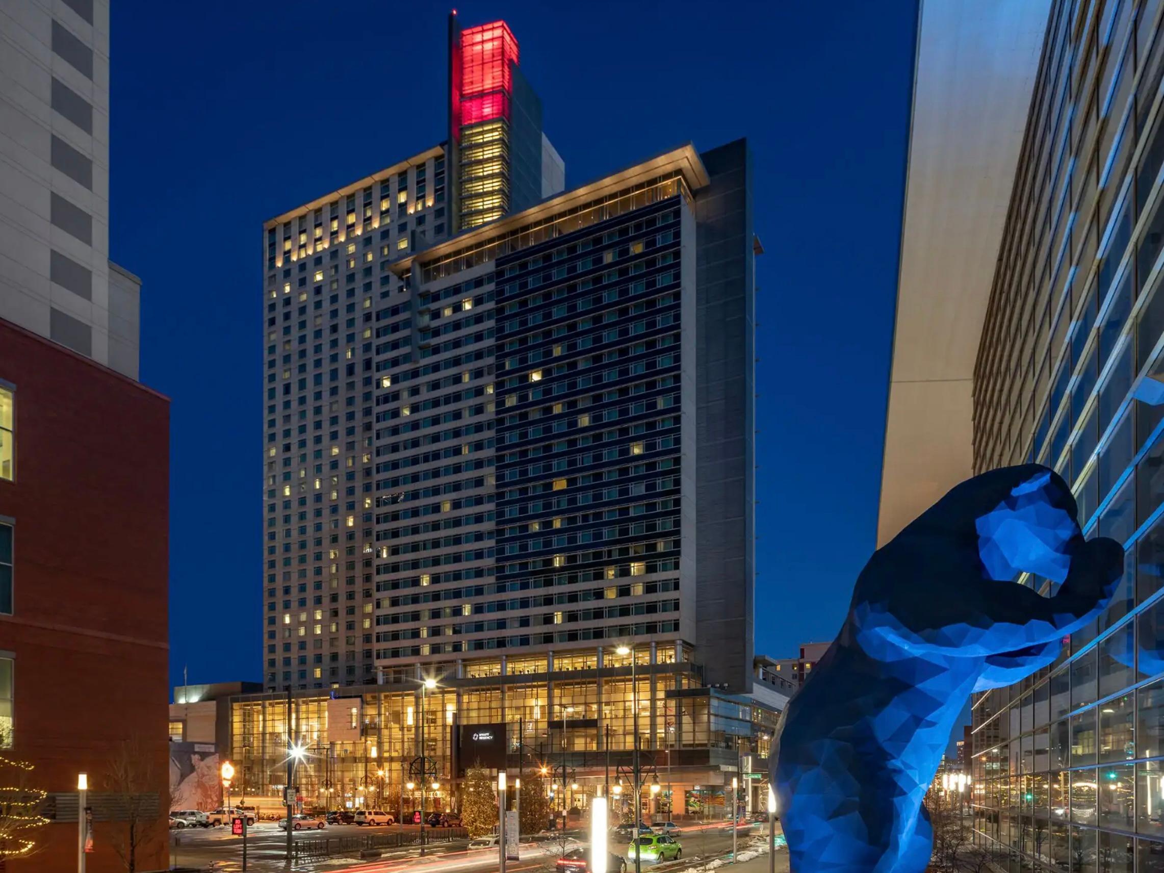 Exterior of the Hyatt Regency Denver at Colorado Convention Center at night.